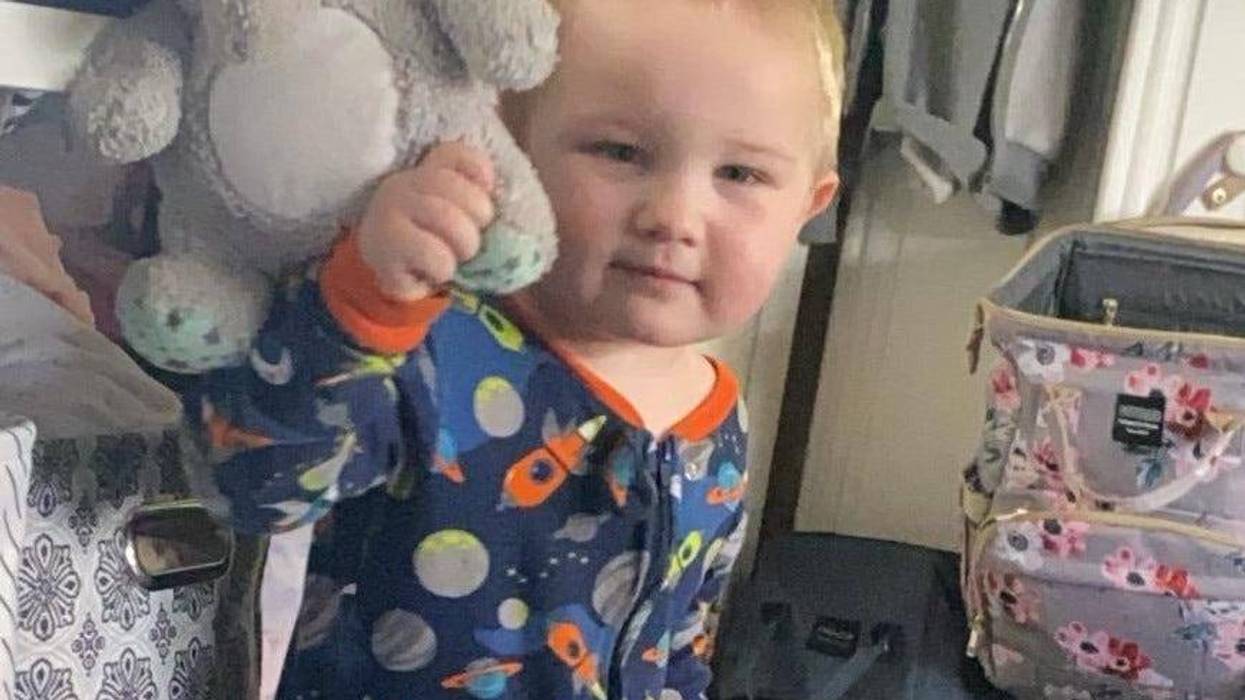 Little boy holding stuffed animal
