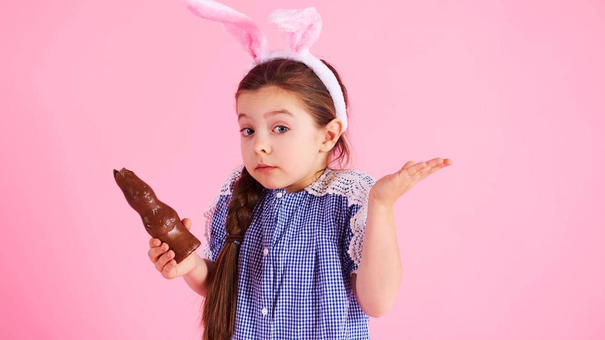 Little Girl Eating Her Easter Chocolate Bunny