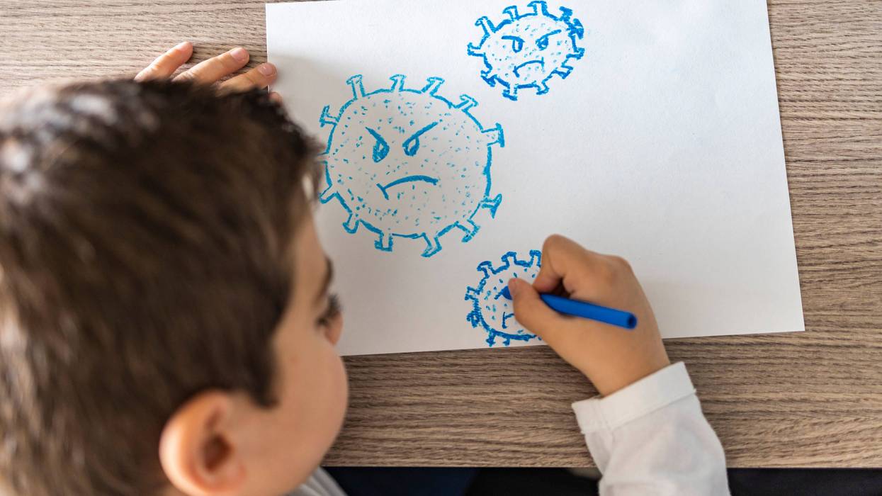 Little kid drawing a coronavirus