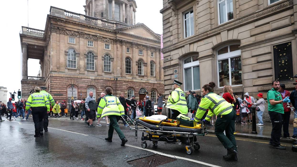 LIVERPOOL, ENGLAND - MAY 26: A large emergency service presence is pictured on Water Street after a car reportedly drives into the crowd during the Liverpool Trophy Parade on May 26, 2025 in Liverpool, England.