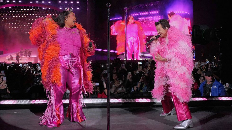 Lizzo literally got her flowers from Harry Styles after topping him on the charts