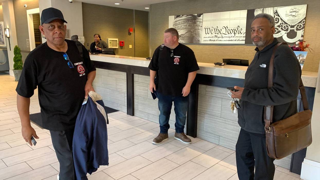 Local 234 president Brian Pollitt (far right) and negotiators arrive at the Wyndham Hotel in Old City for SEPTA contract talks.