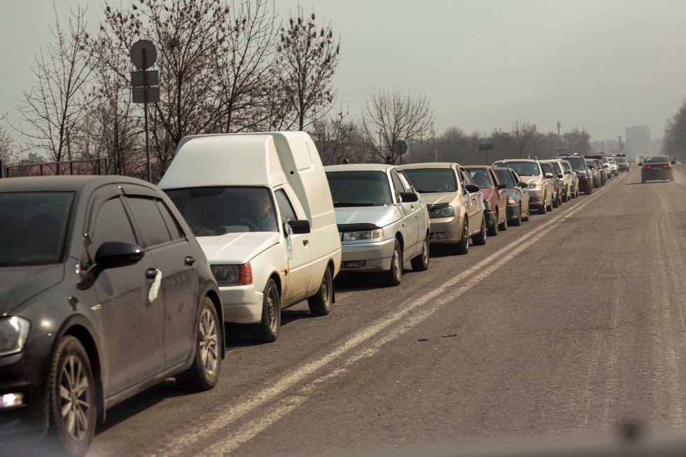 Local residents lineup in their cars to leave Mariupol for more peaceful place on the territory which is under the Government of the Donetsk People