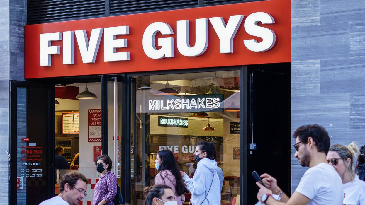 Logo and facade of Five Guys, fast food restaurant chain.