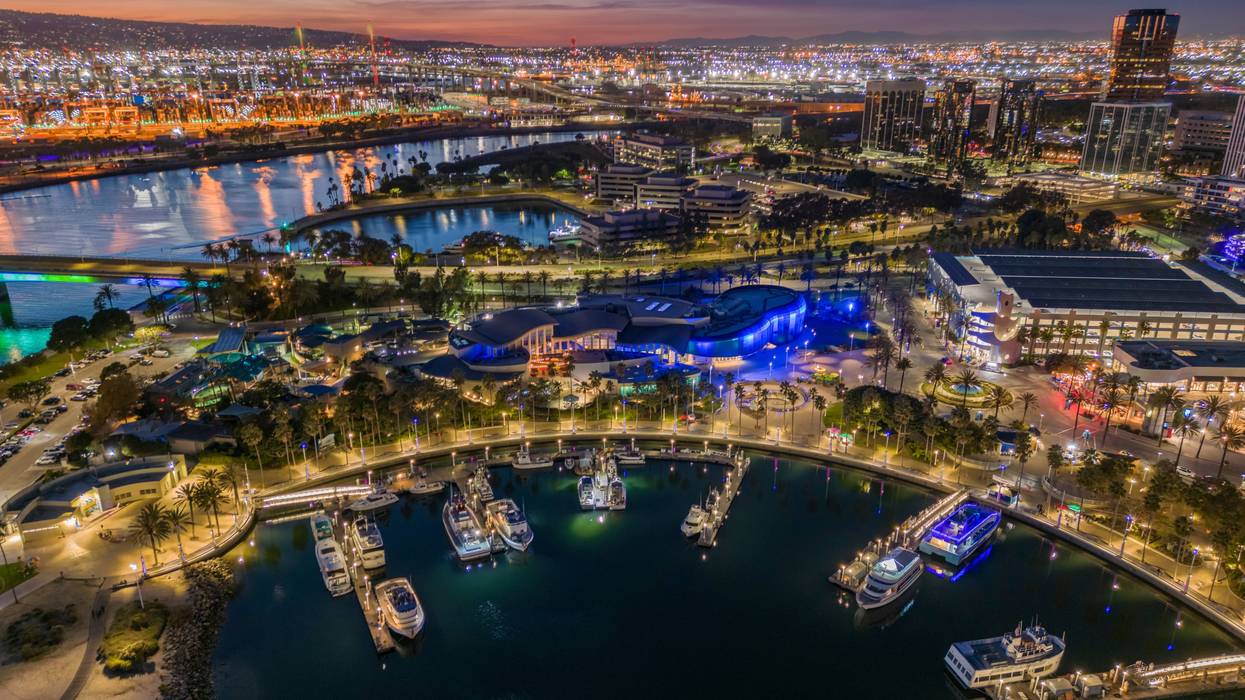 Long Beach Rainbow Harbor at dusk with the downtown and the port in the background.