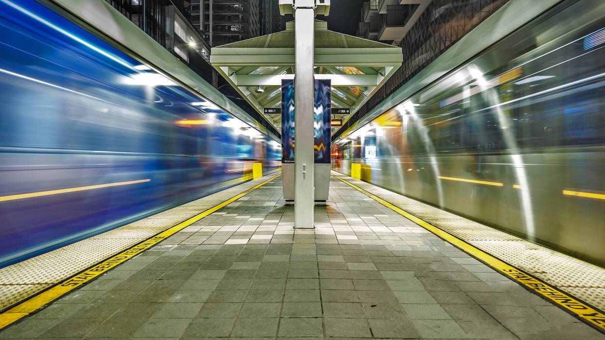 long exposure of trains passing at station