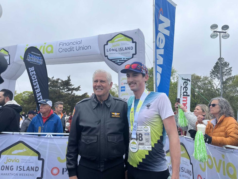 Long Island Marathon winner Ryan Clifford and Nassau County Executive Bruce Blakeman.