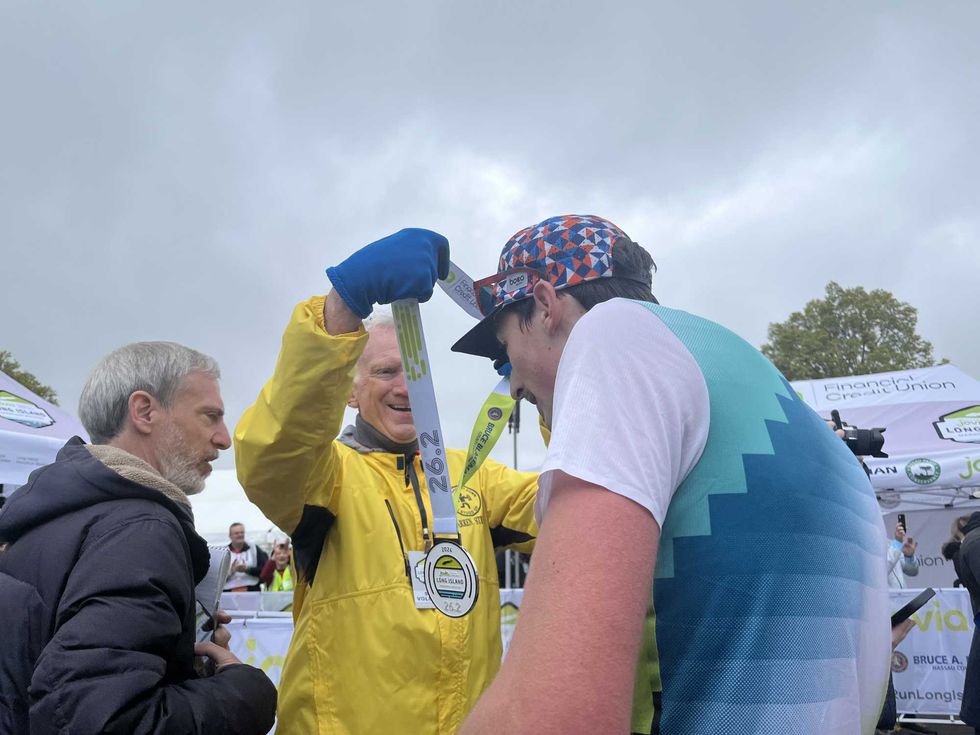 Long Island Marathon winner Ryan Clifford receiving his medal.