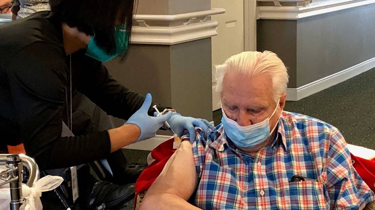 Long-term care facility residents roll up sleeves for COVID-19 booster shots