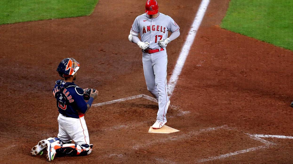 Los Angeles Angels designated hitter Shohei Ohtani (17) crosses home plate after hitting a solo home run against the Houston Astros during the eighth inning at Minute Maid Park.