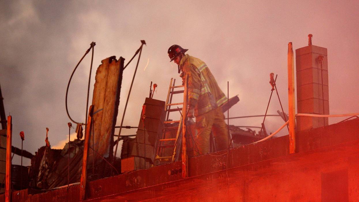 LOS ANGELES, CA - DECEMBER 8: Firefighters battle a fire that destroyed a seven-story apartment building under construction on December 8, 2014 in Los Angeles, California. The fire also damaged nearby high-rise buildings and shut down freeways, causing massive traffic problems for morning computers.