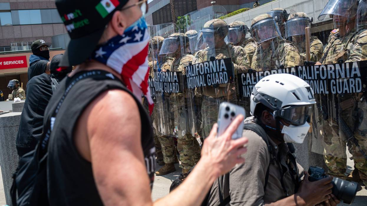 LOS ANGELES, CALIFORNIA - JUNE 08: The National Guard and protesters stand off outside of a downtown jail in Los Angeles following two days of clashes with police during a series of immigration raids on June 08, 2025 in Los Angeles, California. Tensions in the city remain high after the Trump administration called in the National Guard against the wishes of city leaders.