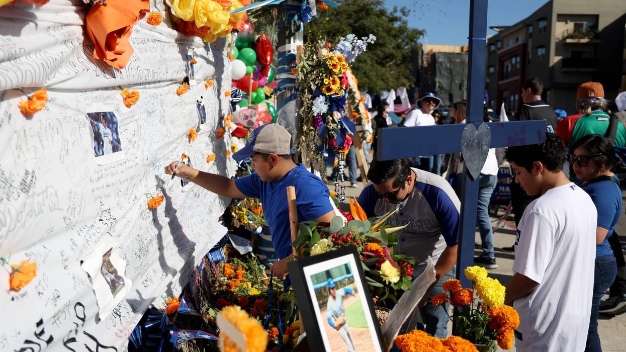 LOS ANGELES, CALIFORNIA - NOVEMBER 03: Fans leaves notes and mementos during an unveiling of a mural of late Los Angeles Dodgers pitcher Fernando Valenzuela, painted by Robert Vargas on November 03, 2024 in Los Angeles, California.