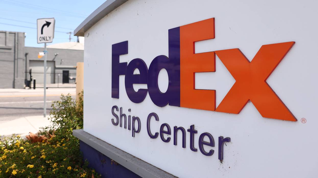 LOS ANGELES, CALIFORNIA - SEPTEMBER 22: The FedEx logo is displayed at a FedEx Ship Center on September 22, 2021 in Los Angeles, California. FedEx plans to increase shipping rates in 2022 with FedEx home delivery going up an average of 5.9% and FedEx Freight shipments being raised by up to 7.9%.