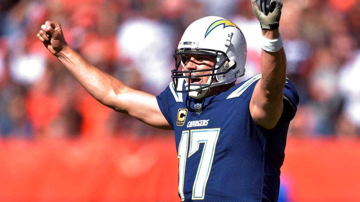 Los Angeles Chargers quarterback Philip Rivers celebrates a touchdown in the first half during an NFL football game against the Los Angeles Chargers, Sunday, Oct. 14, 2018, in Cleveland. (AP Photo/David Richard)