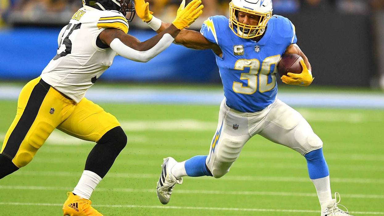 Los Angeles Chargers running back Austin Ekeler (30) pushes off Pittsburgh Steelers inside linebacker Devin Bush (55)