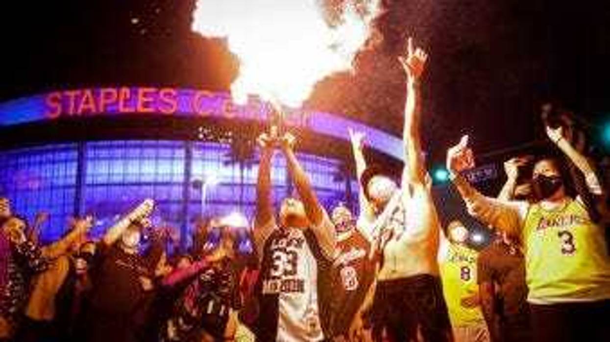 Los Angeles Lakers fans celebrate outside of Staples Center, Sunday, Oct. 11, 2020, in Los Angeles, after the Lakers defeated the Miami Heat in Game 6 of basketball's NBA Finals to win the championship. (AP Photo/Christian Monterrosa)