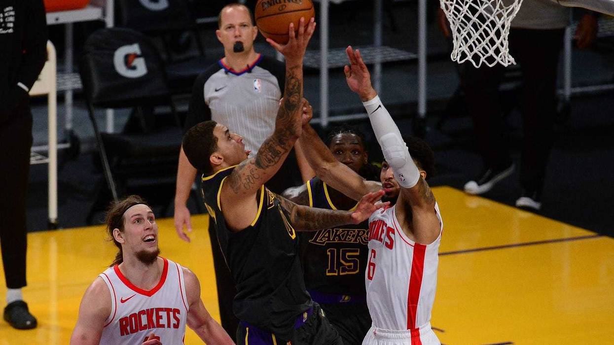 Los Angeles Lakers forward Kyle Kuzma (0) moves to the basket against Houston Rockets forward Kenyon Martin Jr. (6) during the second half at Staples Center.