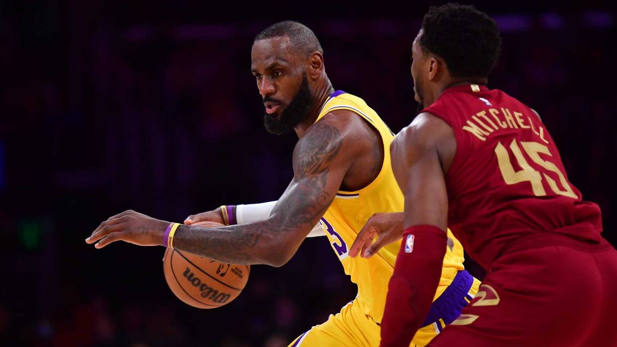 Los Angeles Lakers forward LeBron James (23) moves the ball against Cleveland Cavaliers guard Donovan Mitchell (45) during a game this past season.
