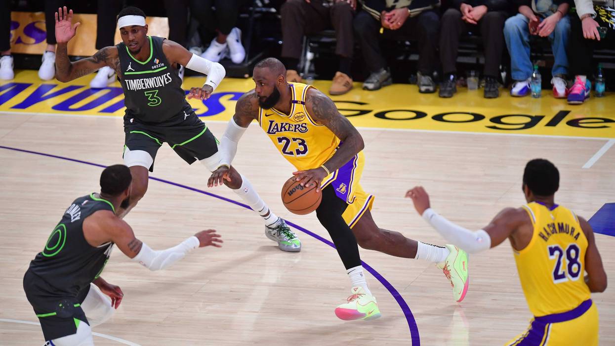 Los Angeles Lakers forward LeBron James (23) moves to the basket against Minnesota Timberwolves forward Jaden McDaniels (3) and guard Mike Conley (10) during the second half in game five of first round for the 2025 NBA Playoffs at Crypto.com Arena.