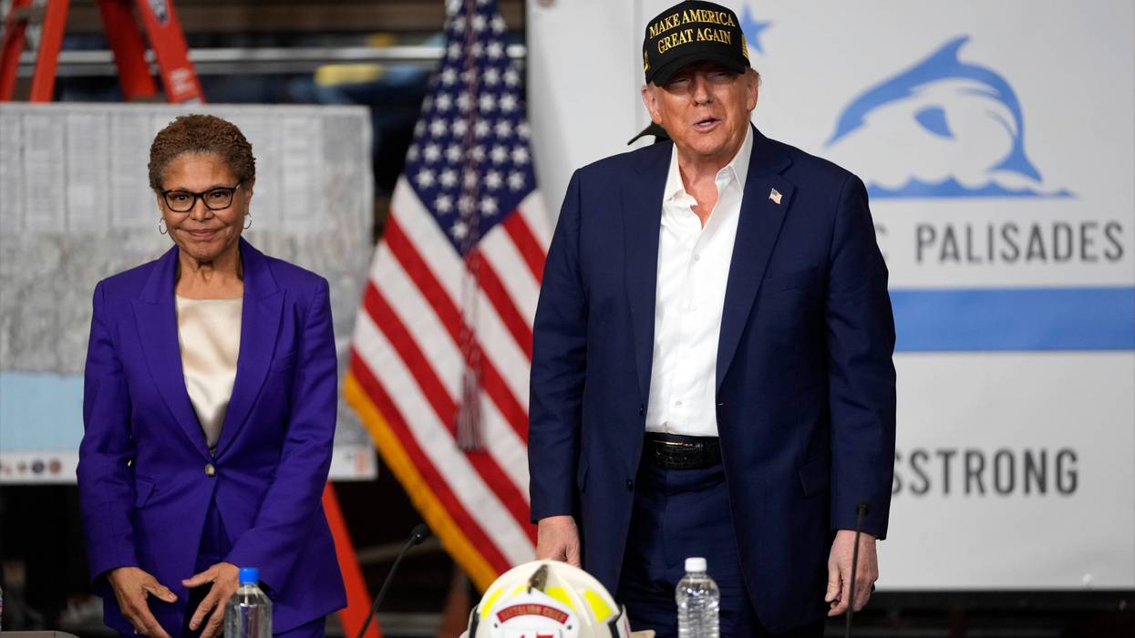 Los Angeles Mayor Karen Bass watches as President Donald Trump talks after a briefing in the Pacific Palisades neighborhood affected by recent wildfires in Los Angeles, Friday, Jan. 24, 2025.