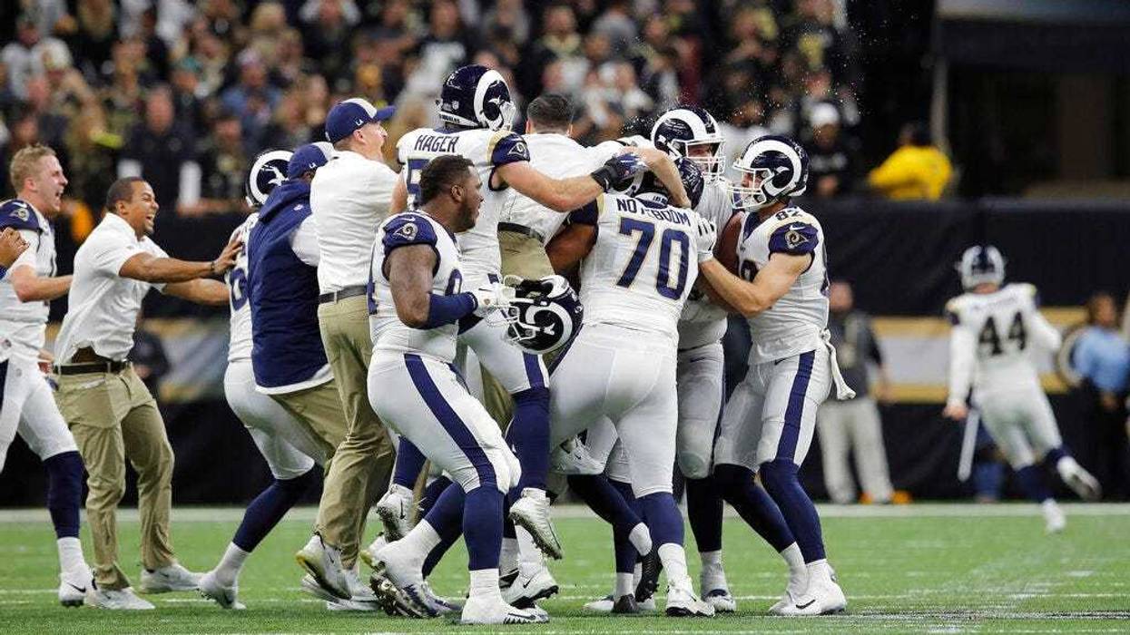 Los Angeles Rams celebrate after overtime of the NFL football NFC championship game against the New Orleans Saints