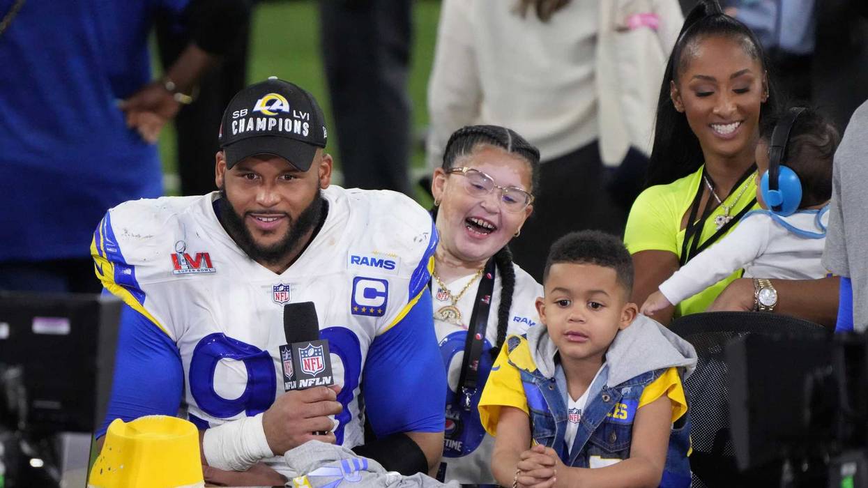 Los Angeles Rams defensive end Aaron Donald (99) is interviewed with his wife Erica Donald