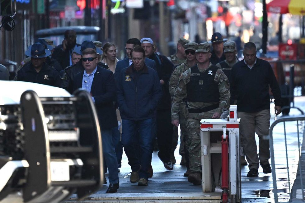 Louisiana Governor Jeff Landry (C) inspects Bourbon Street in the the French Quarter on January 2, 2025 in New Orleans