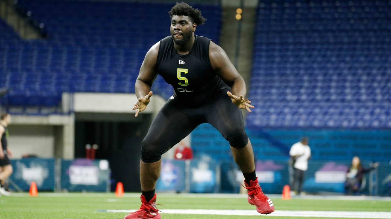 Louisville Cardinals offensive lineman Mekhi Becton (OL05) goes through workout drills during the 2020 NFL Combine at Lucas Oil Stadium.