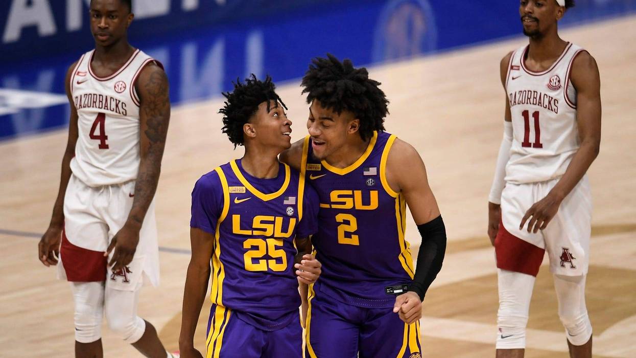 LSU guard Eric Gaines (25) and LSU forward Trendon Watford (2) celebrate their 78 to 71 win against Arkansas in the SEC Men's Basketball Tournament semifinal game at Bridgestone Arena Saturday, March 13, 2021 in Nashville, Tenn. Nas Sec Lsu Ark 045