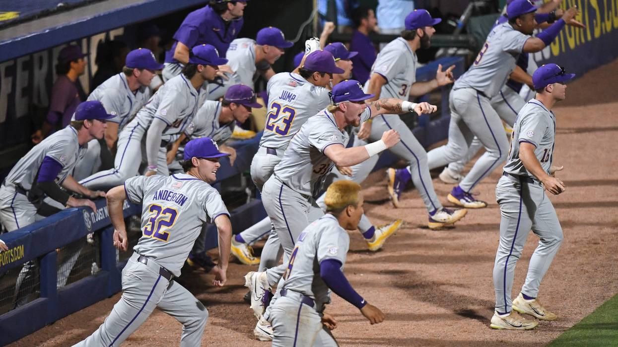 LSU players rush onto the field to celebrate at the Hoover Met during the SEC Tournament. LSU won 11-10 with 9th inning heroics
