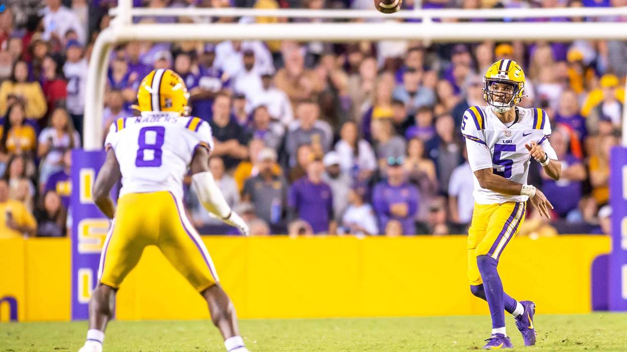 LSU quarterback Jayden Daniels throws a pass to Malik Nabors