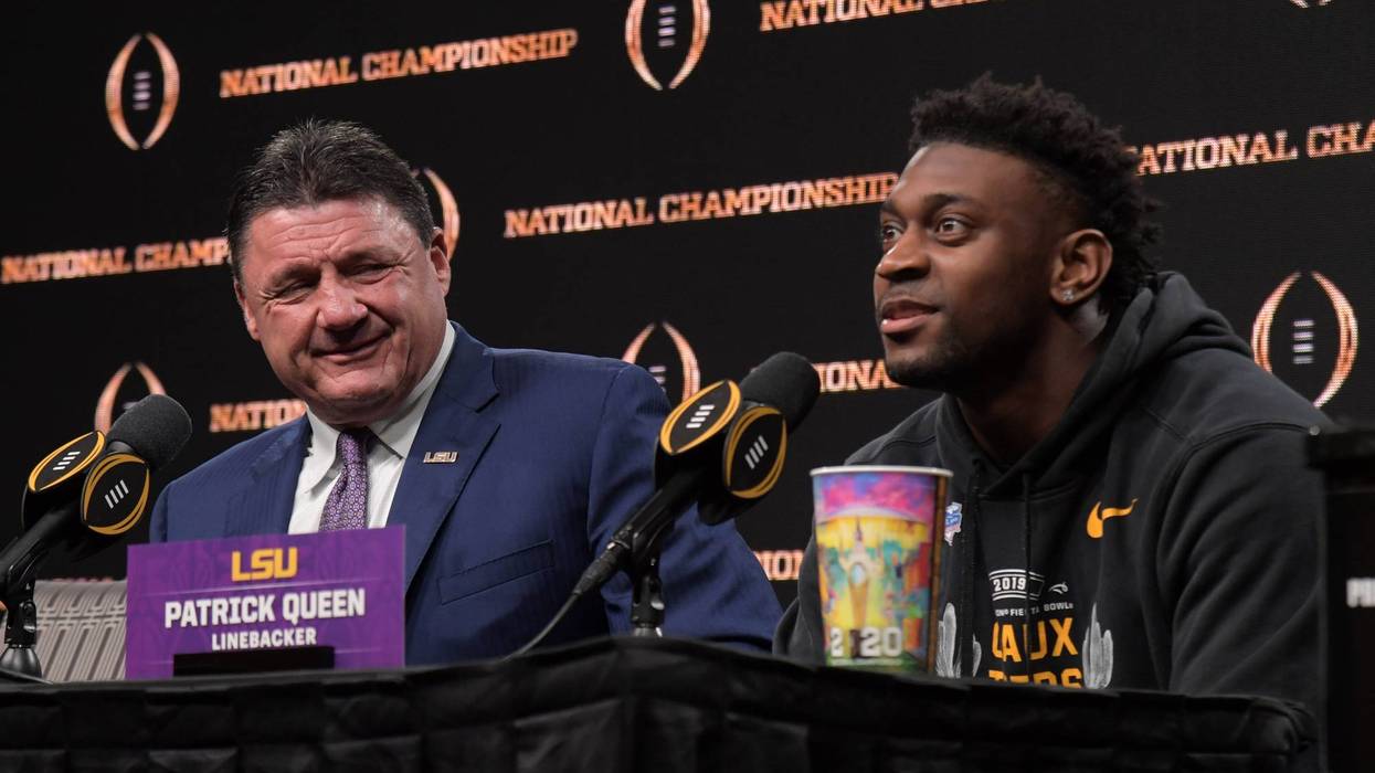 LSU Tigers coach Ed Orgeron (left) and linebacker Patrick Queen during the CFP National Championship champions press conference at the Sheraton New Orleans. LSU defeated Clemson 42-25.