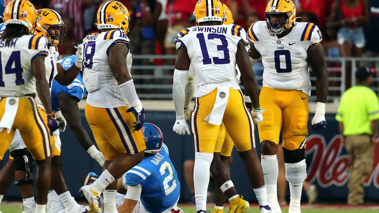 LSU Tigers defensive linemen Maason Smith (0) reacts after a sack