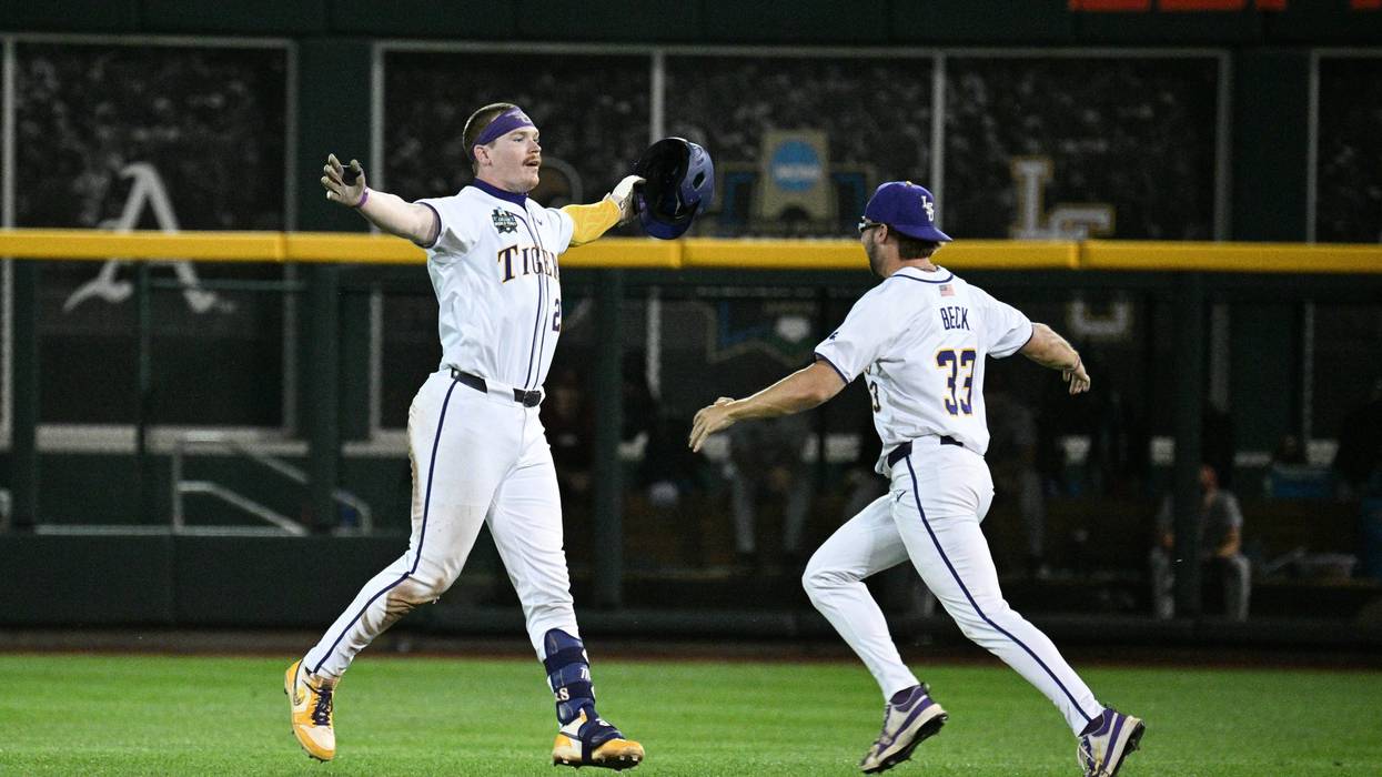 LSU Tigers first baseman Jared Jones (22) celebrates with Dalton Beck (33)