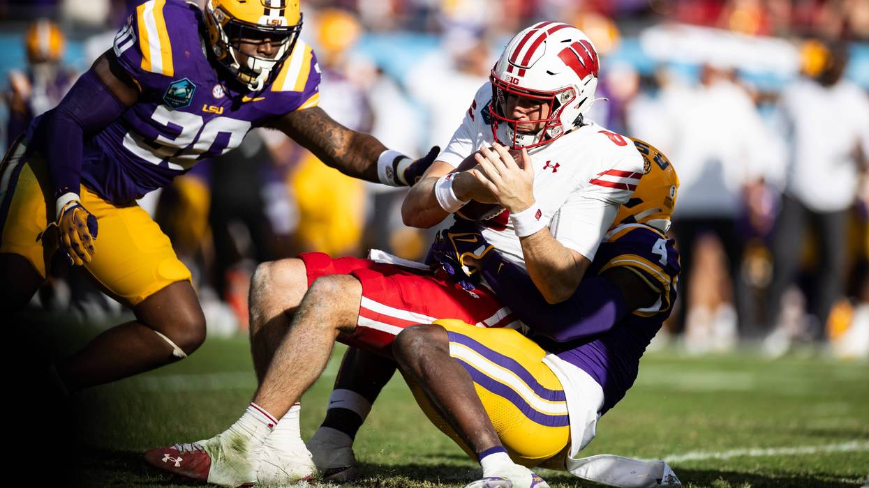 LSU Tigers linebacker Harold Perkins Jr. sacks Wisconsin Badgers quarterback Tanner Mordecai