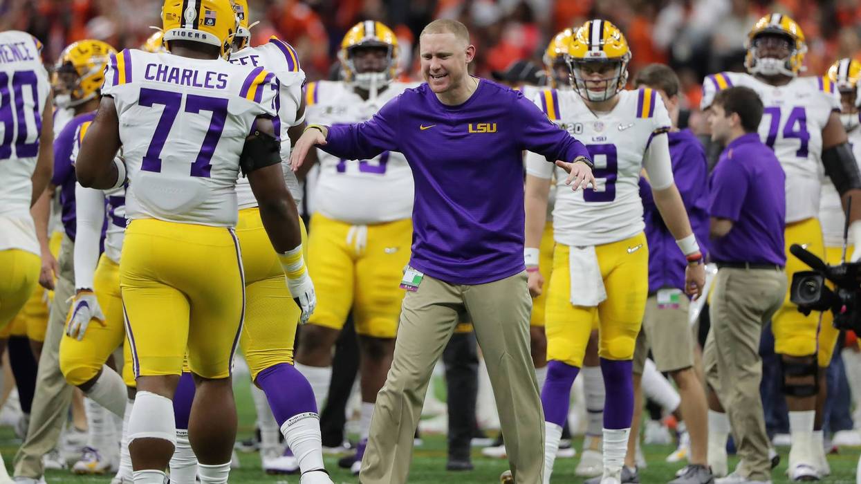 LSU Tigers passing game coordinator Joe Brady talks to his team before the College Football Playoff national championship game against the Clemson Tigers at Mercedes-Benz Superdome.