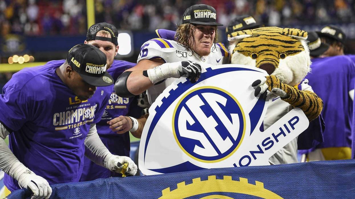 LSU Tigers players celebrate after defeating the Georgia Bulldogs in the 2019 SEC Championship Game at Mercedes-Benz Stadium.