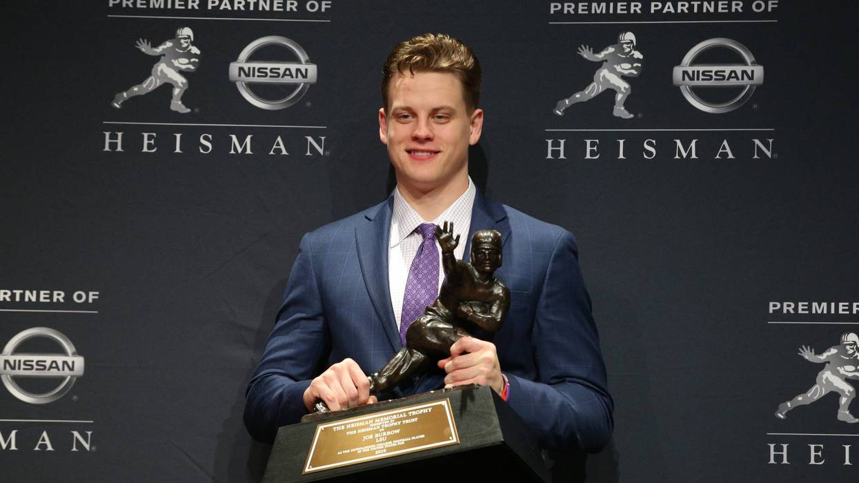 LSU Tigers quarterback and Heisman Trophy winner Joe Burrow poses with the trophy during a post ceremony press conference at the New York Marriott Marquis.