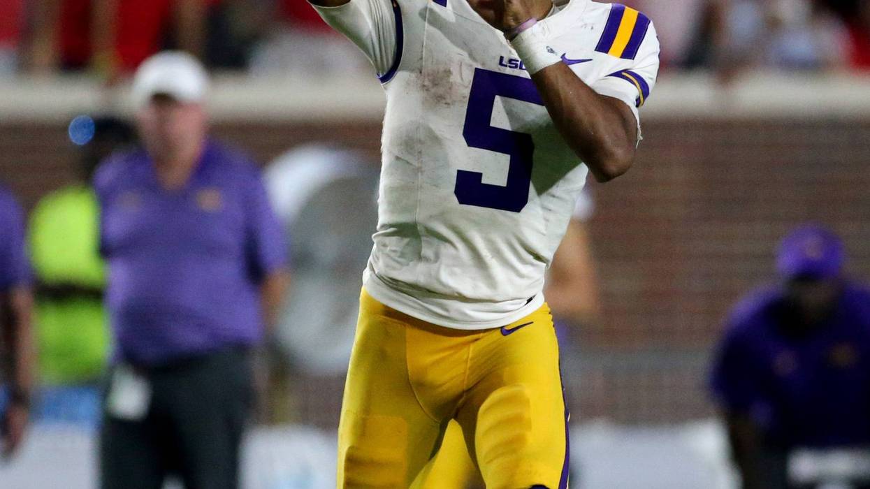 LSU Tigers quarterback Jayden Daniels (5) passes the ball during the second half against the Mississippi Rebels