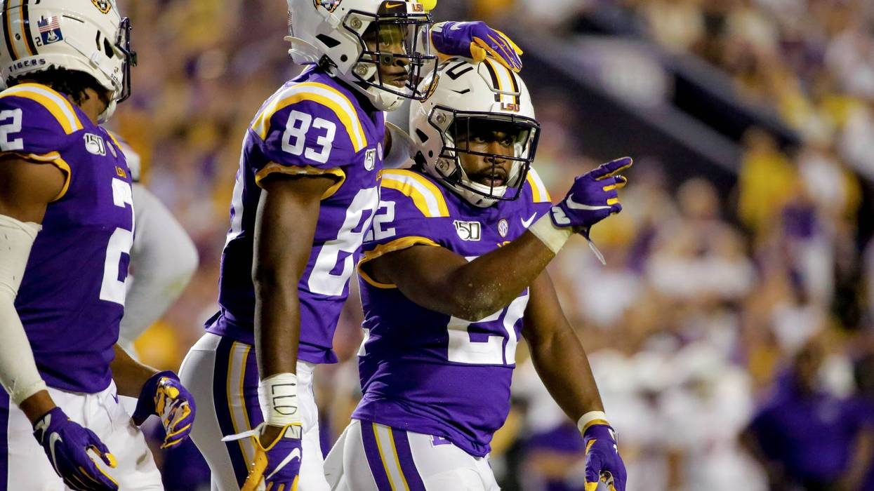 LSU Tigers running back Clyde Edwards-Helaire (22) celebrates with wide receiver Jaray Jenkins (83) during the second quarter against the Northwestern State Demons at Tiger Stadium.