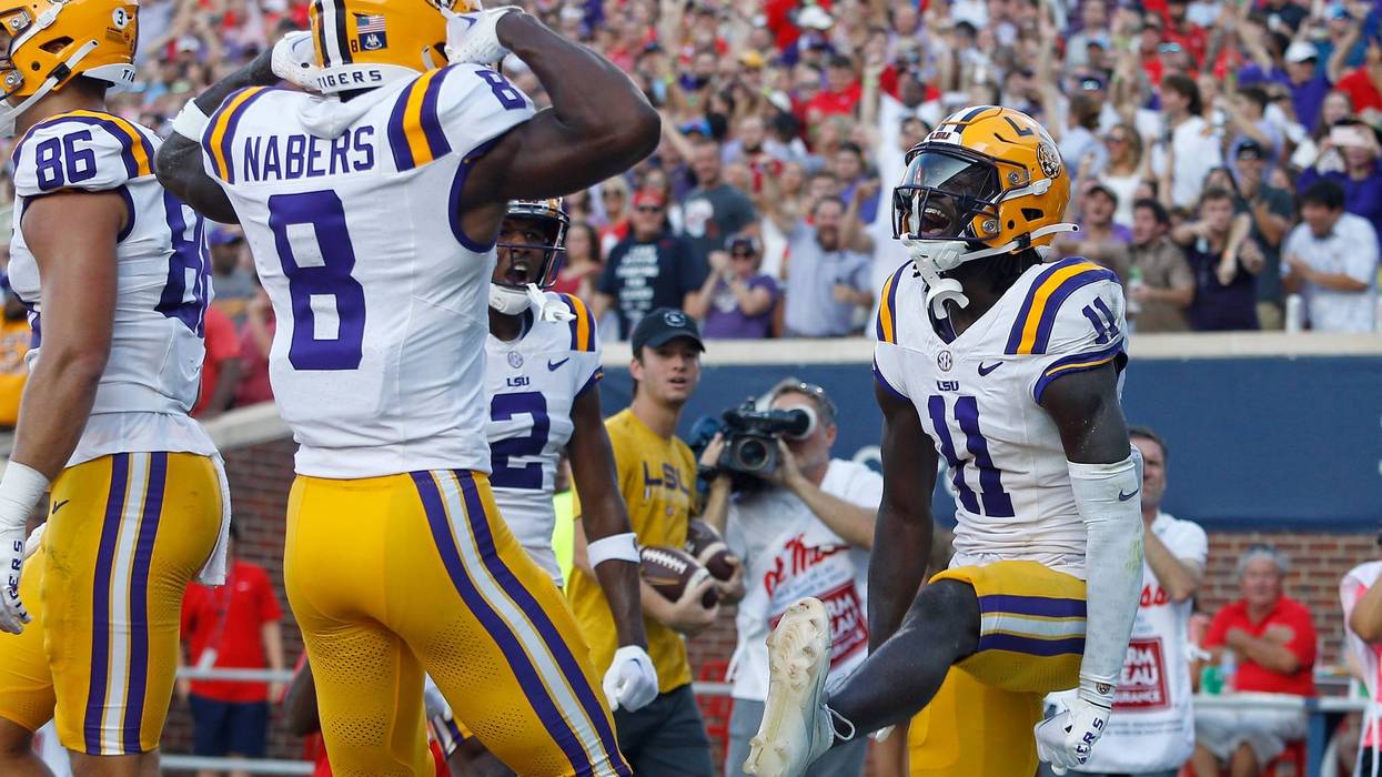 LSU Tigers wide receiver Brian Thomas Jr. (11) reacts with LSU Tigers wide receiver Malik Nabers (8)