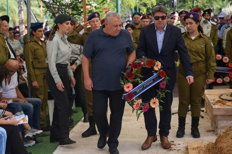Lt. Gen. (Res.) Gadi Eizenkot (L), Minister of Knesset and former IDF Chief of Staff, and Ofir Akunis (R), then-Minister of Innovation, Science and Technology of Israel, lay a wreath at the grave of Col. Asaf Hamami, commander of Gaza Division