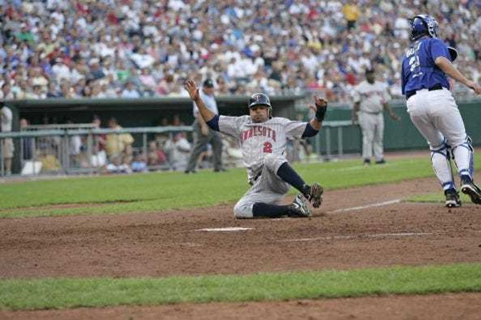 Luis Rivas of the Minnesota Twins scores a run against the Kansas City Royals at Kauffman Stadium in Kansas City, Mo. on July 9, 2005. The Royals won 12-8.