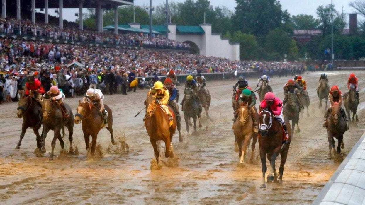 Luis Saez rides Maximum Security across the finish line first followed by Flavien Prat on Country House during the 145th running of the Kentucky Derby horse race at Churchill Downs