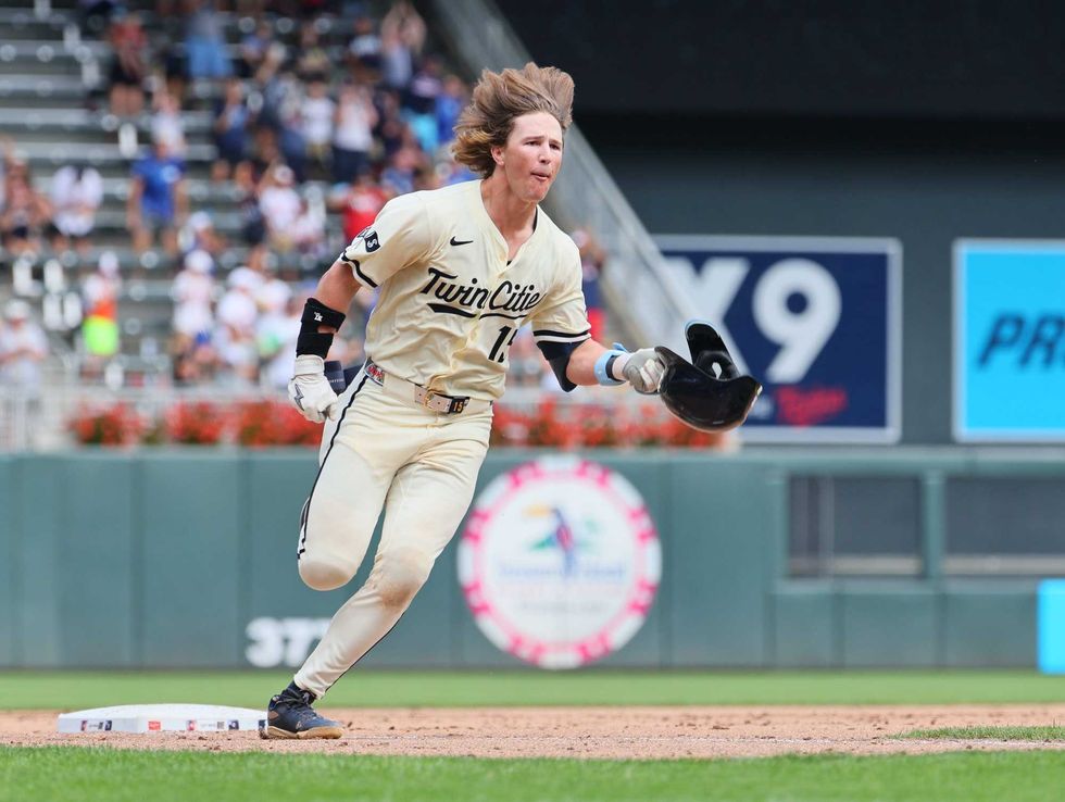 Luke Keaschall #15 of the Minnesota Twins celebrates his two-run walk off in the eleventh inning against the Kansas City Royals at Target Field on August 10, 2025 in Minneapolis, Minnesota. The Minnesota Twins defeated the Kansas City Royals 5-3 in 11 innings.