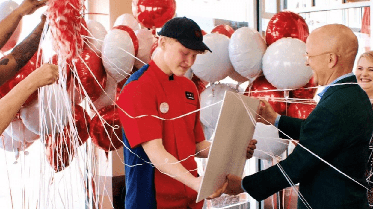 Luke Marasco receiving a scholarship from Chick-fil-A CEO Andrew T. Cathy