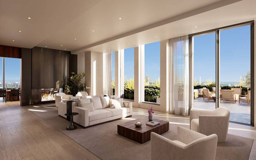 Luxurious living room featuring a modern fireplace, floor-to-ceiling windows, and outdoor terrace.