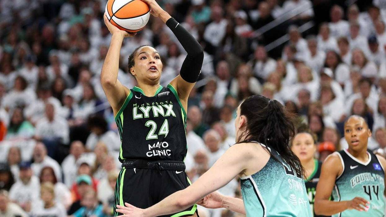 Lynx forward Napheesa Collier (24) shoots over New York Liberty forward Breanna Stewart (30) during the first half of game four of the 2024 WNBA Finals at Target Center.
