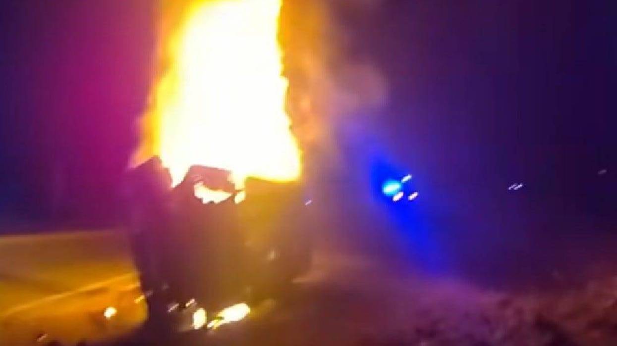 Macomb County woman pulled from burning car